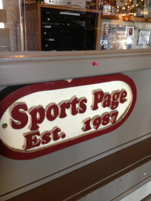 Sports Page signage as you enter the establishment.